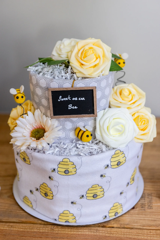 A cake with bees and flowers on it